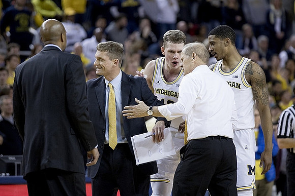 Deandre Haynes, Luke Yaklich, Moritz Wagner (13), John Beilein, and Charles Matthews (1)