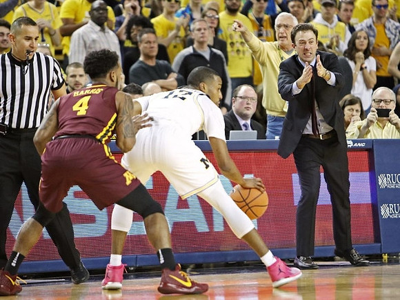 Muhammad-Ali Abdur-Rahkman (12) and Minnesota Head Coach Richard Pitino