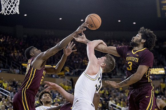 Isaiah Livers (4) and Moritz Wagner (13)