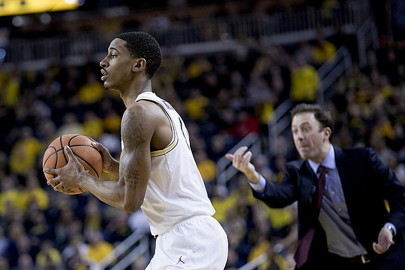 Charles Matthews (1) and Minnesota Head Coach Richard Pitino