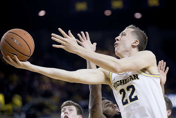 Duncan Robinson (22) and Jon Teske (15)