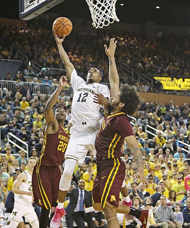 Muhammad-Ali Abdur-Rahkman (12) and Duncan Robinson (22)