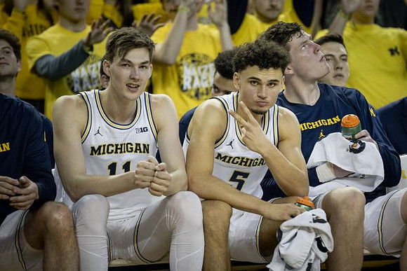 Colin Castleton (11), Adrien Nunez (5), and Jon Teske (15)