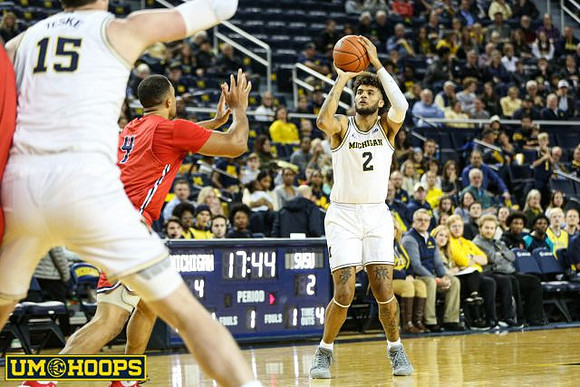 Jon Teske (15) and Isaiah Livers (2)