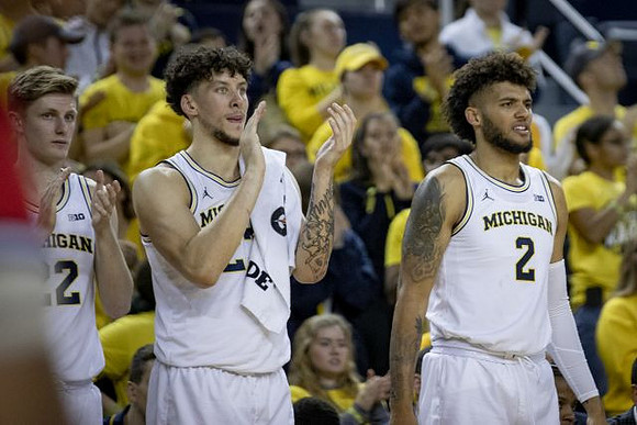 Luke Wilson (32), Brandon Johns Jr. (23), and Isaiah Livers (2)