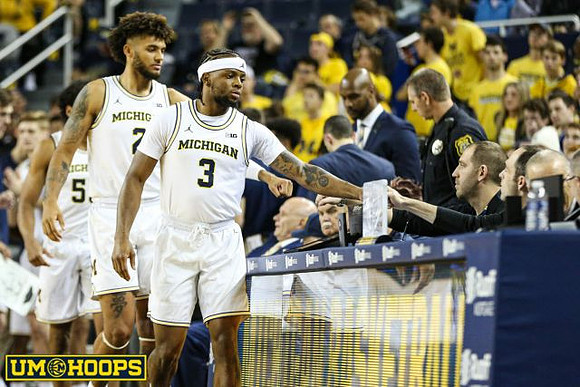 Eli Brooks (55), Isaiah Livers (2), and Zavier Simpson (3)