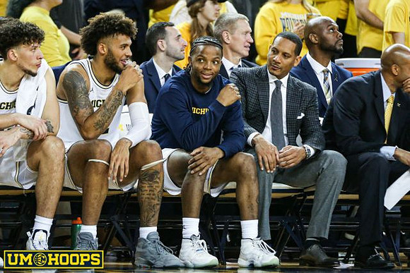 Brandon Johns Jr. (23), Isaiah Livers (2), Zavier Simpson (3), Howard Eisley, and Saddi Washington