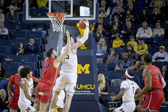 Eli Brooks (55), Jon Teske (15), and Zavier Simpson (3)