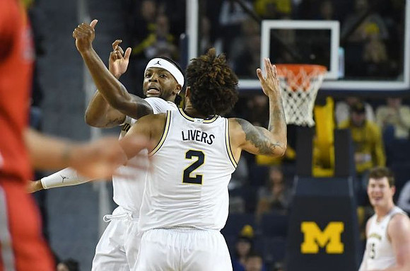 Isaiah Livers (2), Zavier Simpson (3), and Jon Teske (15)
