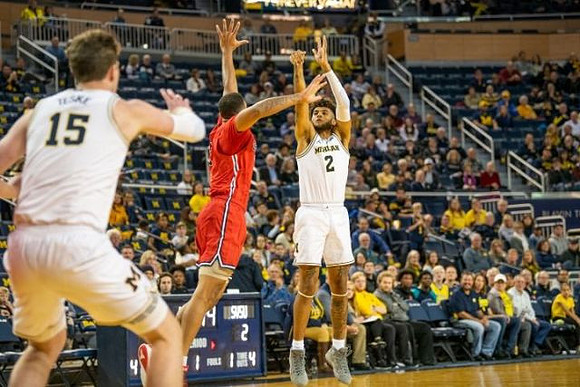 Jon Teske (15) and Isaiah Livers (2)