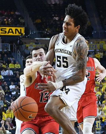 Colin Castleton (11) and Eli Brooks (55)
