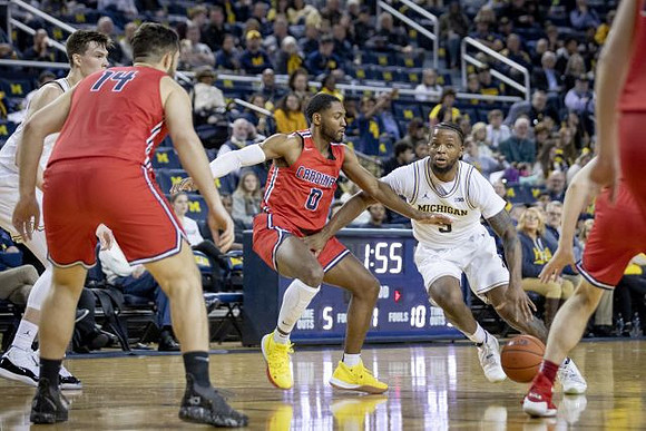 Colin Castleton (11) and Zavier Simpson (3)