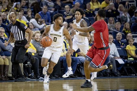 David DeJulius (0) and Eli Brooks (55)