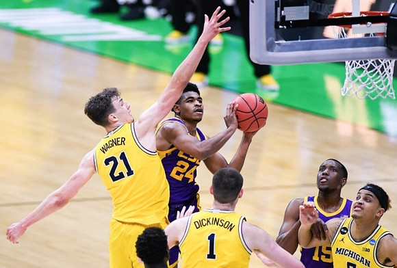 Franz Wagner (21), Hunter Dickinson (1), and Terrance Williams II (5)