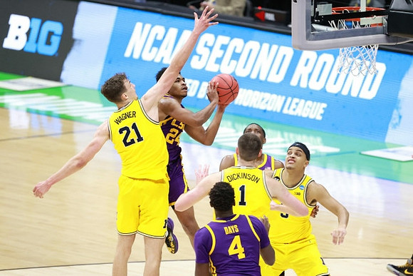 Franz Wagner (21), Hunter Dickinson (1), and Terrance Williams II (5)