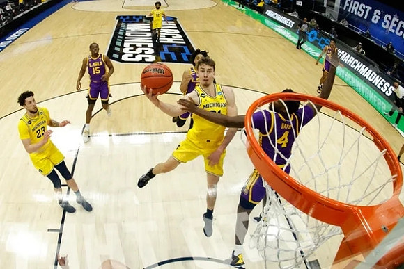 Brandon Johns Jr. (23), Franz Wagner (21), and Mike Smith (12)
