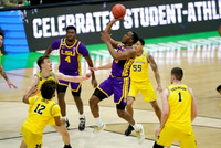 Mike Smith (12), Franz Wagner (21), Eli Brooks (55), and Hunter Dickinson (1)