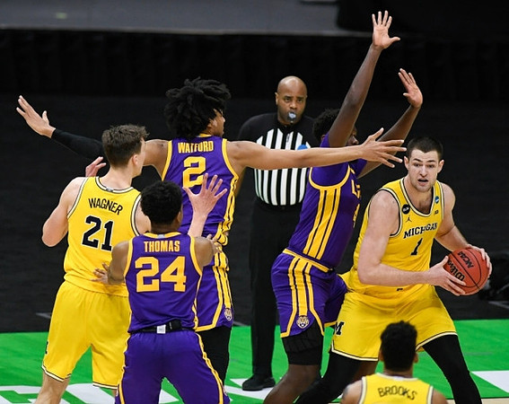 Franz Wagner (21), Hunter Dickinson (1), and Eli Brooks (55)