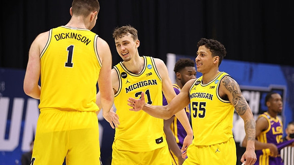 Hunter Dickinson (1), Franz Wagner (21), and Eli Brooks (55)