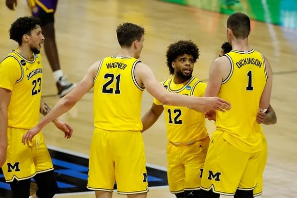 Brandon Johns Jr. (23), Franz Wagner (21), Mike Smith (12), Hunter Dickinson (1), and Eli Brooks (55)
