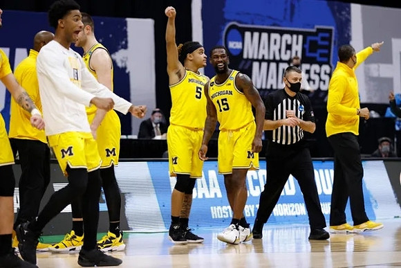 Terrance Williams II (5), Chaundee Brown Jr. (15), Jay Smith, and Michigan Team