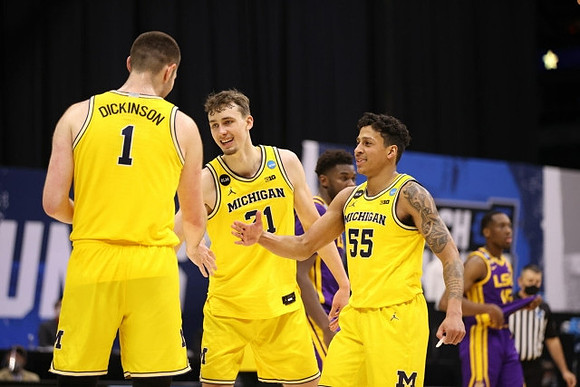 Hunter Dickinson (1), Franz Wagner (21), and Eli Brooks (55)