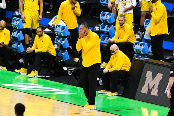 Howard Eisley, Juwan Howard, Jay Smith, and Phil Martelli