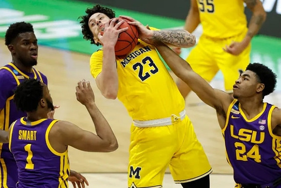 Brandon Johns Jr. (23) and Eli Brooks (55)