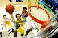 Brandon Johns Jr. (23), Hunter Dickinson (1), and Franz Wagner (21)