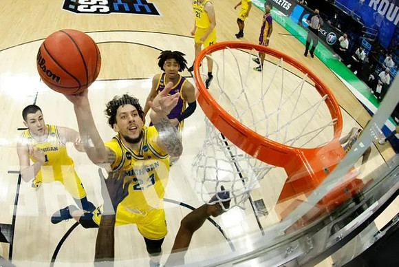 Brandon Johns Jr. (23), Hunter Dickinson (1), and Franz Wagner (21)