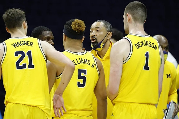 Franz Wagner (21), Chaundee Brown Jr. (15), Terrance Williams II (5), Juwan Howard, and Hunter Dickinson (1)