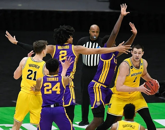 Hunter Dickinson (1), Franz Wagner (21), and Eli Brooks (55)