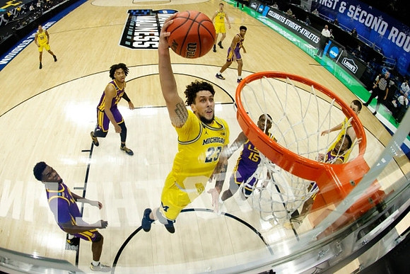 Brandon Johns Jr. (23), Eli Brooks (55), Hunter Dickinson (1), and Franz Wagner (21)