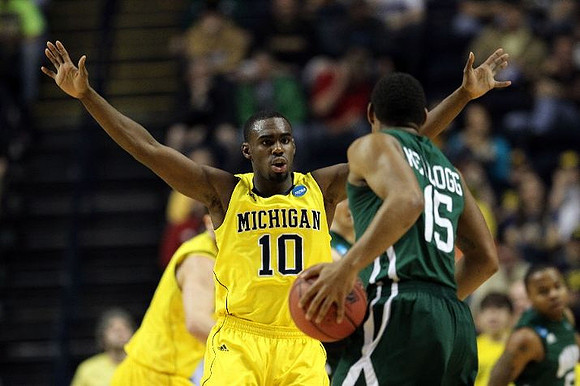 Tim Hardaway Jr. (10) and Zack Novak (0)