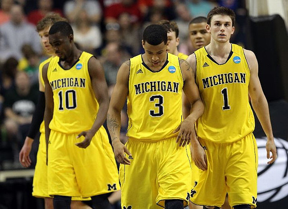 Evan Smotrycz (23), Tim Hardaway Jr. (10), Trey Burke (3), Zack Novak (0), Stu Douglass (1), and Jordan Morgan (52)