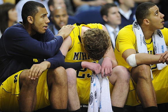 Jon Horford (15), Evan Smotrycz (23), and Jordan Morgan (52)
