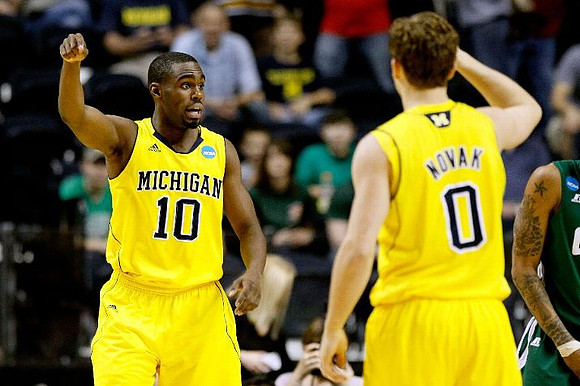 Tim Hardaway Jr. (10) and Zack Novak (0)