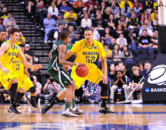 Stu Douglass (1), Trey Burke (3), and Jordan Morgan (52)