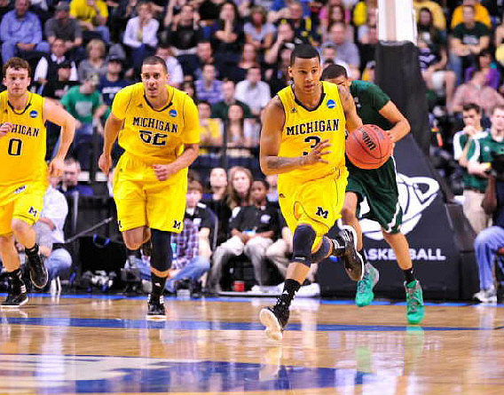 Zack Novak (0), Jordan Morgan (52), and Trey Burke (3)
