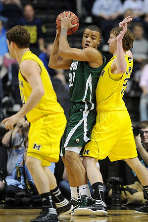 Zack Novak (0) and Evan Smotrycz (23)