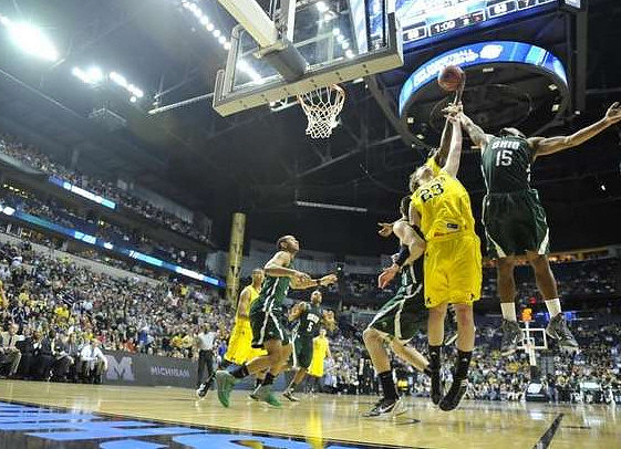 Trey Burke (3) and Evan Smotrycz (23)