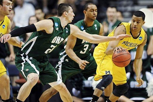 Zack Novak (0) and Trey Burke (3)