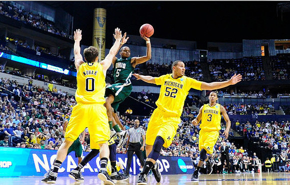 Zack Novak (0), Jordan Morgan (52), and Trey Burke (3)