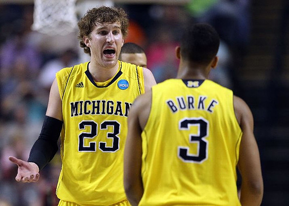Evan Smotrycz (23) and Trey Burke (3)