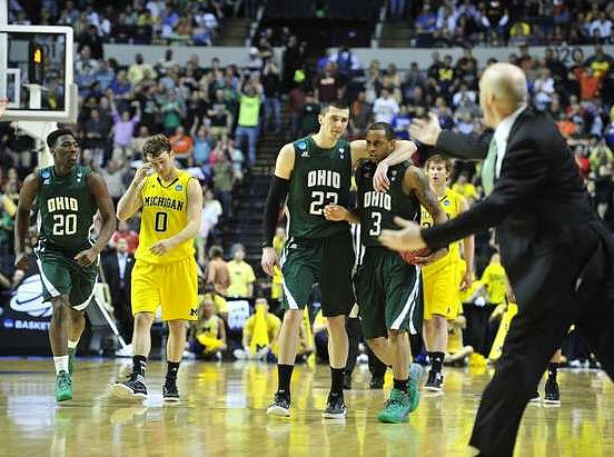 Zack Novak (0), Evan Smotrycz (23), and John Groce