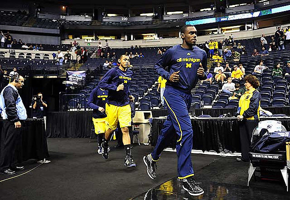 Jon Horford (15) and Tim Hardaway Jr. (10)