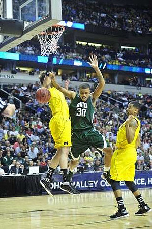 Zack Novak (0) and Trey Burke (3)