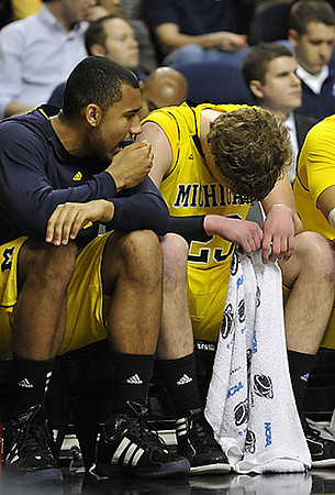 Jon Horford (15) and Evan Smotrycz (23)