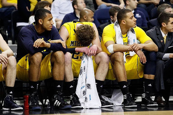 Jon Horford (15), Evan Smotrycz (23), and Jordan Morgan (52)