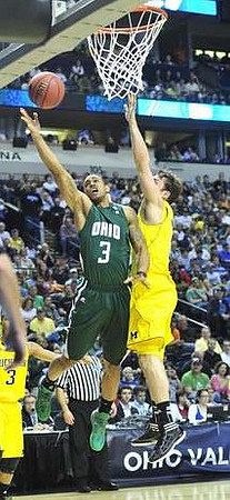 Zack Novak (0) and Trey Burke (3)